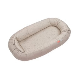 Cozy Nest baby nest in sand color, designed for comfort, safety, and easy cleaning for infants.
