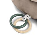Sensory rings in green and beige on Tummy Time Activity Toy Croco by Done By Deer, perfect for baby's playtime.