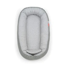 Cozy Nest in grey by Done By Deer, a soft and safe space for babies to relax, play, and enjoy tummy time.