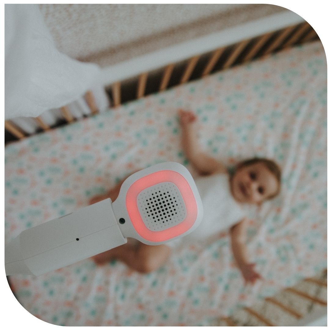 Oricom 5" Smart HD Nursery Pal Skyview Baby Monitor above a sleeping baby in a cot.